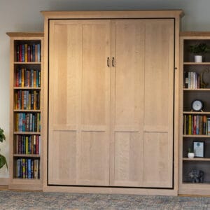 Natural maple Queen-sized murphy bed with bookcases on the side