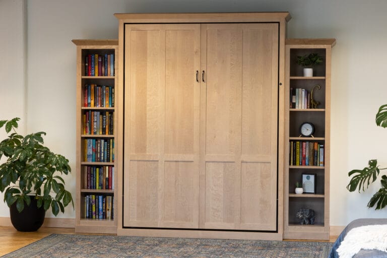 Natural maple Queen-sized murphy bed with bookcases on the side